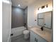 Well-lit bathroom featuring a tub, shower, and stylish vanity with sleek fixtures at 16600 Sw 23Rd Avenue Rd, Ocala, FL 34473