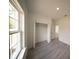 Bedroom featuring one window and a closet with bi-fold doors at 16600 Sw 23Rd Avenue Rd, Ocala, FL 34473