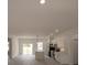 Open-concept kitchen features a large island and sleek, modern white cabinetry at 16600 Sw 23Rd Avenue Rd, Ocala, FL 34473