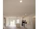 Open-concept kitchen features a large island and sleek, modern white cabinetry at 16600 Sw 23Rd Avenue Rd, Ocala, FL 34473
