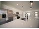 Stunning kitchen boasts a large island, stainless appliances, and pendant lighting at 16600 Sw 23Rd Avenue Rd, Ocala, FL 34473