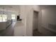 Kitchen with white cabinets, an island, and quartz countertop at 16600 Sw 23Rd Avenue Rd, Ocala, FL 34473