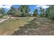 Large backyard with play equipment, offering space for outdoor activities and recreation at 2299 Nw 135Th Ln, Citra, FL 32113