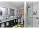 Bathroom featuring a stylish vanity, glass shower enclosure, and modern fixtures for a spa-like experience at 2299 Nw 135Th Ln, Citra, FL 32113