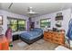 Comfortable bedroom with natural light, a ceiling fan, and ample space for relaxation and personalization at 2299 Nw 135Th Ln, Citra, FL 32113