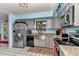 Well-lit kitchen equipped with stainless steel appliances, ample cabinetry, and functional workspace at 2299 Nw 135Th Ln, Citra, FL 32113