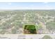 Aerial view of a charming home with mature trees and landscaping, close to amenities at 2312 Corrine Dr, Orlando, FL 32803