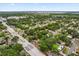 Aerial view of a residential neighborhood with mature trees and well-maintained streets near a large commercial area at 2312 Corrine Dr, Orlando, FL 32803