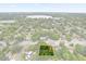 An aerial perspective illustrates the lot's layout near local amenities and a serene lakeside at 2312 Corrine Dr, Orlando, FL 32803