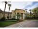 Elegant clubhouse featuring stately columns, lush landscaping, and a welcoming entrance, perfect for community gatherings and events at 2652 Robert Trend Jones # 2652, Orlando, FL 32835