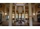 A grand lobby featuring soaring columns, elegant seating, and stylish decor, creating a sophisticated welcome for residents and guests at 2652 Robert Trend Jones # 2652, Orlando, FL 32835