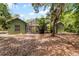 Exterior view of the house showing the screen enclosed pool and backyard at 2705 Curryville Rd, Chuluota, FL 32766