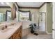 Bright bathroom showcases a tub, glass shower, and vanity sink at 2705 Curryville Rd, Chuluota, FL 32766