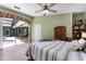 Comfortable bedroom with an open view to the porch and swimming pool area at 2705 Curryville Rd, Chuluota, FL 32766