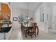 Bright dining area featuring tile floors, wainscotting, and a columned entry way at 2705 Curryville Rd, Chuluota, FL 32766