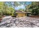 Detached garage with large driveway and lush greenery, offering ample parking at 2705 Curryville Rd, Chuluota, FL 32766