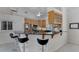 Bright kitchen featuring breakfast bar with stainless steel appliances and lots of cabinets at 2705 Curryville Rd, Chuluota, FL 32766