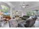 Cozy living room with a fireplace, large window, and comfortable seating, creating a relaxing atmosphere at 2705 Curryville Rd, Chuluota, FL 32766