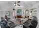 Inviting living room with a fireplace, large window, and comfortable seating, perfect for relaxation and entertainment at 2705 Curryville Rd, Chuluota, FL 32766