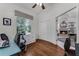 Home office with hardwood floors, a window, and access to a fireplace at 2705 Curryville Rd, Chuluota, FL 32766