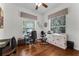 Home office with hardwood floors, natural light and plenty of room to work at 2705 Curryville Rd, Chuluota, FL 32766
