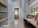 Office space featuring built-in shelves, a window, and tile flooring at 2705 Curryville Rd, Chuluota, FL 32766