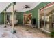 Large screened patio with comfortable seating and access to the house through sliding glass doors at 2705 Curryville Rd, Chuluota, FL 32766