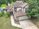 Aerial shot of a two-story home showing the roofline, two-car garage, and surrounding greenery at 2706 Donaldson Dr, Orlando, FL 32812