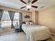 Bright bedroom with a ceiling fan, closet and a large window at 2706 Donaldson Dr, Orlando, FL 32812