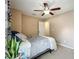 This bedroom has a ceiling fan and a large window at 2706 Donaldson Dr, Orlando, FL 32812
