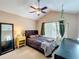 Vaulted ceiling bedroom with ceiling fan, and hanging hammock chair provides a relaxing retreat at 2706 Donaldson Dr, Orlando, FL 32812