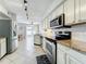 Updated kitchen with stainless steel appliances, granite countertops and ample cabinet space and dining area at 2706 Donaldson Dr, Orlando, FL 32812