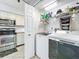 Convenient laundry room adjacent to the kitchen with a modern washer and dryer at 2706 Donaldson Dr, Orlando, FL 32812