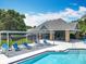 Community pool with clubhouse and lounge chairs, perfect for relaxing and enjoying the outdoors at 2706 Donaldson Dr, Orlando, FL 32812