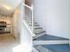 View of the staircase leading to the upper level, adjacent to the kitchen at 2706 Donaldson Dr, Orlando, FL 32812