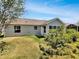 Charming home exterior with well-maintained yard and lush landscaping offers inviting outdoor living at 2708 La Posada Dr, The Villages, FL 32162