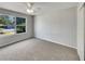 Bright bedroom with plush carpet and a large window, offers a comfortable and inviting space at 2708 La Posada Dr, The Villages, FL 32162