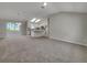 View of the spacious, light-filled living room and kitchen with modern appliances and natural light at 2708 La Posada Dr, The Villages, FL 32162