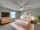 Serene main bedroom with soft lighting, neutral decor, and cozy textures for ultimate relaxation at 2708 La Posada Dr, The Villages, FL 32162