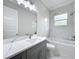 Stylish bathroom featuring marble accents, tub, and vanity at 278 Acorn Dr, Longwood, FL 32750