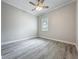 Bright bedroom featuring hardwood flooring and a window view at 278 Acorn Dr, Longwood, FL 32750