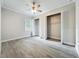 Comfortable bedroom featuring wood-look floors and open closet at 278 Acorn Dr, Longwood, FL 32750