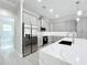 Modern kitchen features sleek gray cabinetry, stainless steel appliances, and a stylish island at 278 Acorn Dr, Longwood, FL 32750
