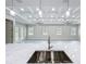 Bright living room with coffered ceiling, recessed lighting, and French doors to backyard at 278 Acorn Dr, Longwood, FL 32750