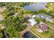 An aerial view showcasing the home's location near a serene lake and lush green surroundings at 2814 Conway Gardens Rd, Orlando, FL 32806