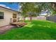 Backyard features a wood deck and large fenced-in lawn at 2814 Conway Gardens Rd, Orlando, FL 32806