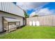 Home generator and propane tanks sit in the spacious backyard with a wooden fence at 2814 Conway Gardens Rd, Orlando, FL 32806