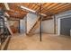 Unfinished basement area with wood stairs, concrete walls, and storage space at 2814 Conway Gardens Rd, Orlando, FL 32806