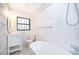 Bright bathroom featuring a freestanding tub, modern vanity, and subway tile at 2814 Conway Gardens Rd, Orlando, FL 32806