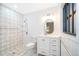 Modern bathroom with white vanity, patterned tile floors, and a shower at 2814 Conway Gardens Rd, Orlando, FL 32806
